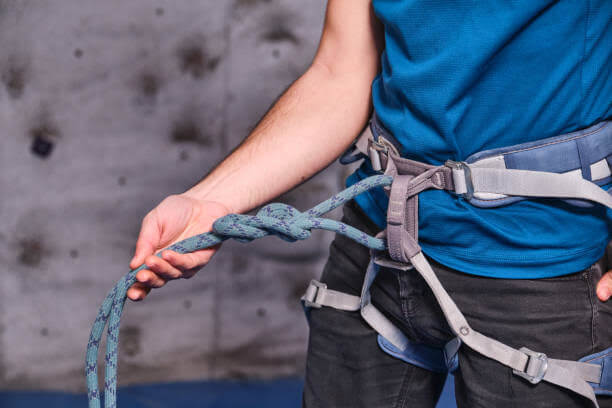 image of a man wearing a climbing harness