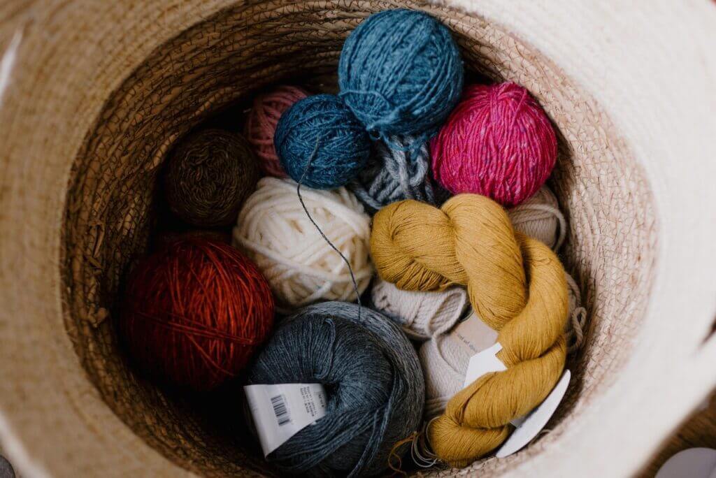Recycled Wool Yarn Rolls in Basket
