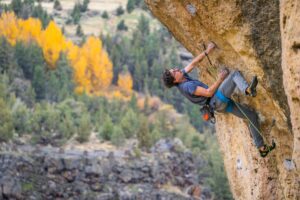 A sport climber assesses the next sequence of movements