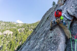 A trad climber leaves the belay station