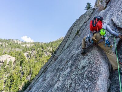 A trad climber leaves the belay station