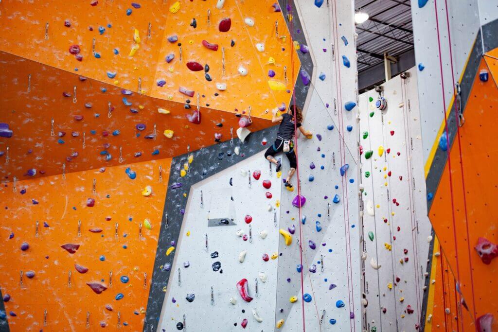 A rock climber can great improve endurance and burn a lot of calories by climbing tall rope routes