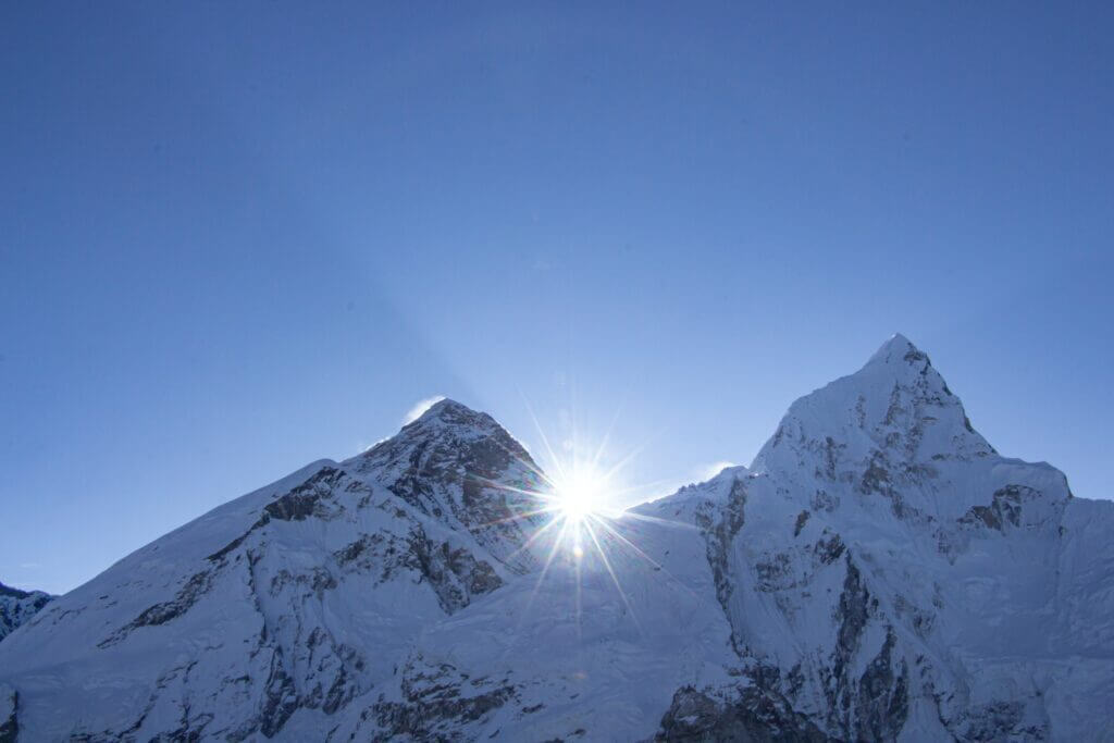 Sun behing Mount Everest