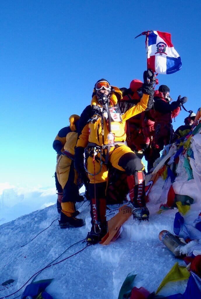 Climber at the summit wearing an oxygen mask